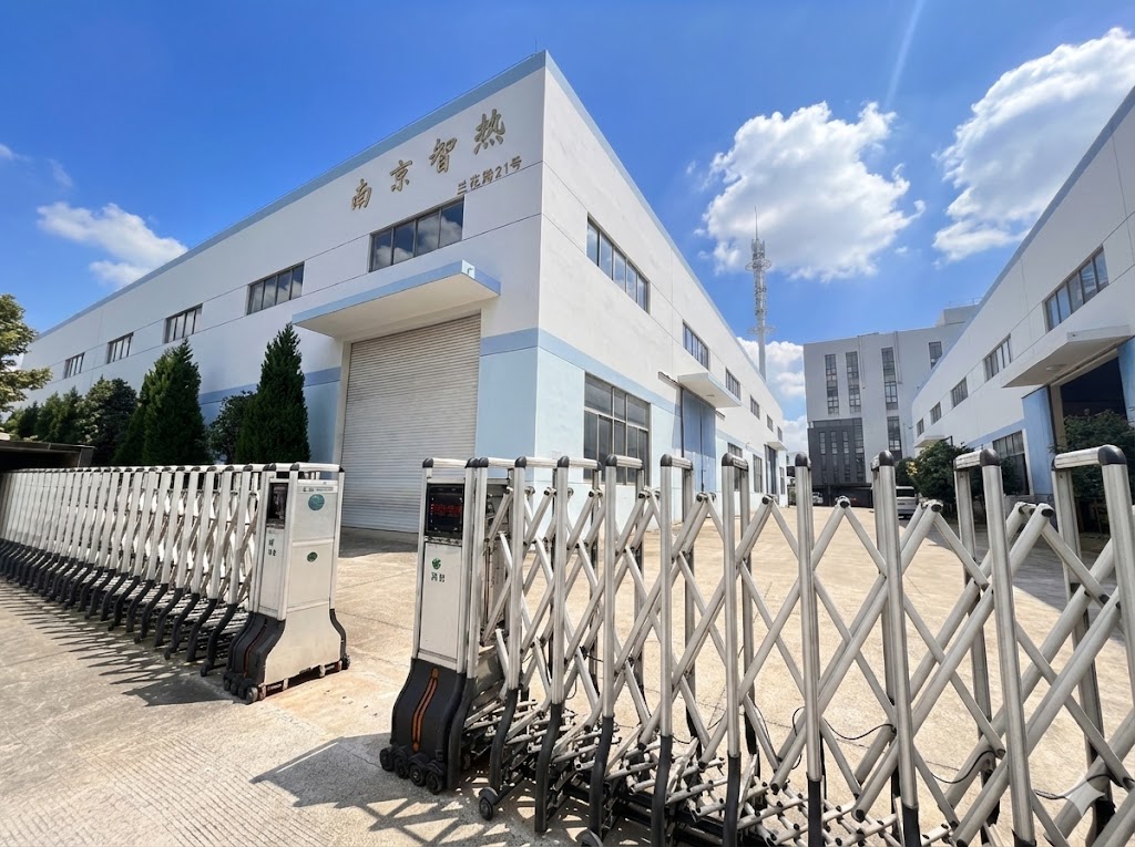 ZR Thermal Tech manufacturing facility showcasing heavy-duty hydraulic presses and laser welders